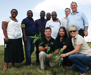 The partners kick off the project with a ceremonial planting of the bamboo shoots.