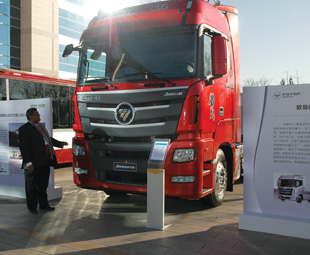 Ismail Asmal, CEO of Foton Trucks SA, admiring the new Auman GTL – launched in China by Foton Beijing.