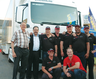 Taking a short break – (from left) Hellberg Transport Management founder Fritz Hellberg; Deputy CEO of MAN Truck & Bus SA Bruce Dickson; Tour drivers Dennis Flowers, Roland Marais, André Nel and Vusi Khoza; TGS product manager Dean Temlett; and (kneeling in front) Tour driver Blackie Swarts and Ignition TV presenter Marius Roberts. 