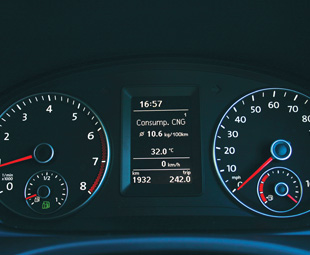 The CNG instrument cluster has two fuel gauges – gas on the left and petrol on the right (UK models of the van show speed in miles/hour).