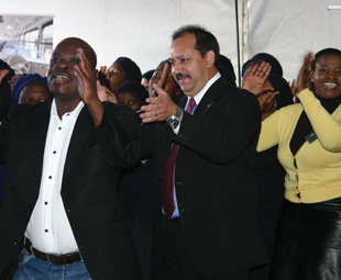 GNT Director, E. Gwangwa, MAN CEO Bruce Dickson, and GNT CEO Busi Mhaga joining in with the St Engenas ZCC Church Choir.