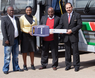 GNT Director, E. Gwangwa, GNT CEO Busi Mhaga, GNT Chairperson Muthuhadini Madzivhandila, and MAN CEO Bruce Dickson, shaking hands on their new business venture. 