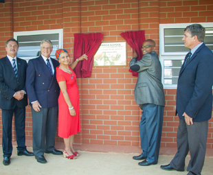 Revealing the plaque from left: Mike Hall-Jones, Key Pietermaritzburg MD; Colin Cowie, chairman of the GM Childlife Foundation; Gishma Johnson, GMSA corporate communications manager; Siyanda Secondary School principal, Selby Madlala; and Grace College principal, Vincent Luksich.