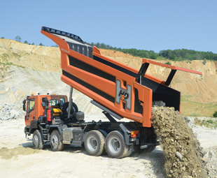 The specially made tipper body features a hydraulic gull-wing tail opening,