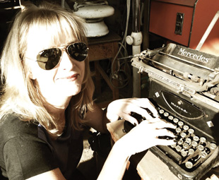 Charleen Clarke “test drives” a Mercedes typewriter!